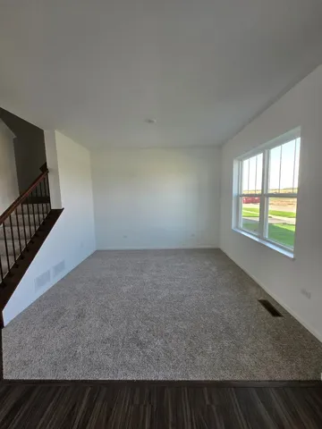 a view of an empty room and window