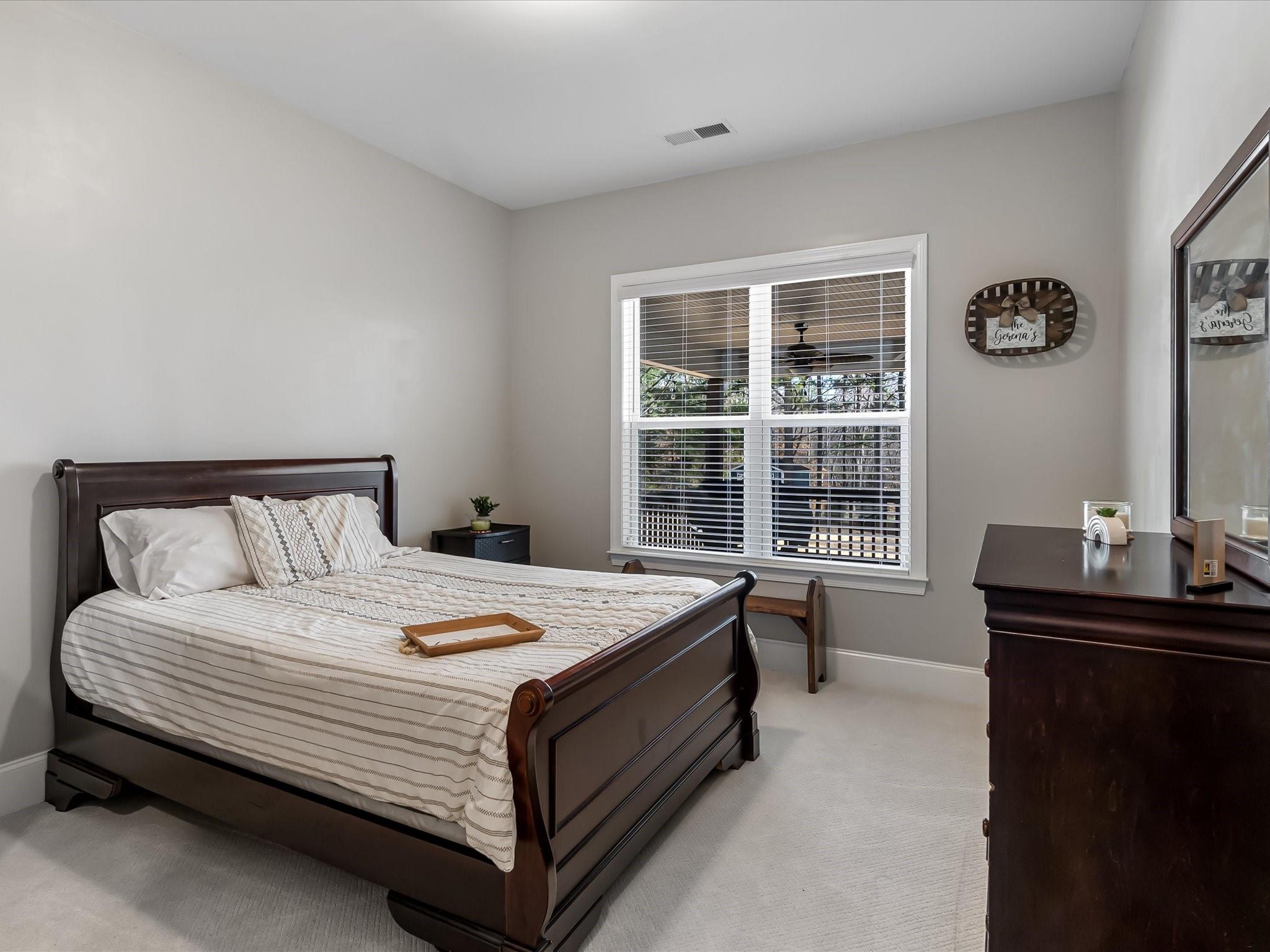 4876 Killian Crossing Drive Denver, NC 28037 - Photo 15 of 46 a bedroom with a bed and a window