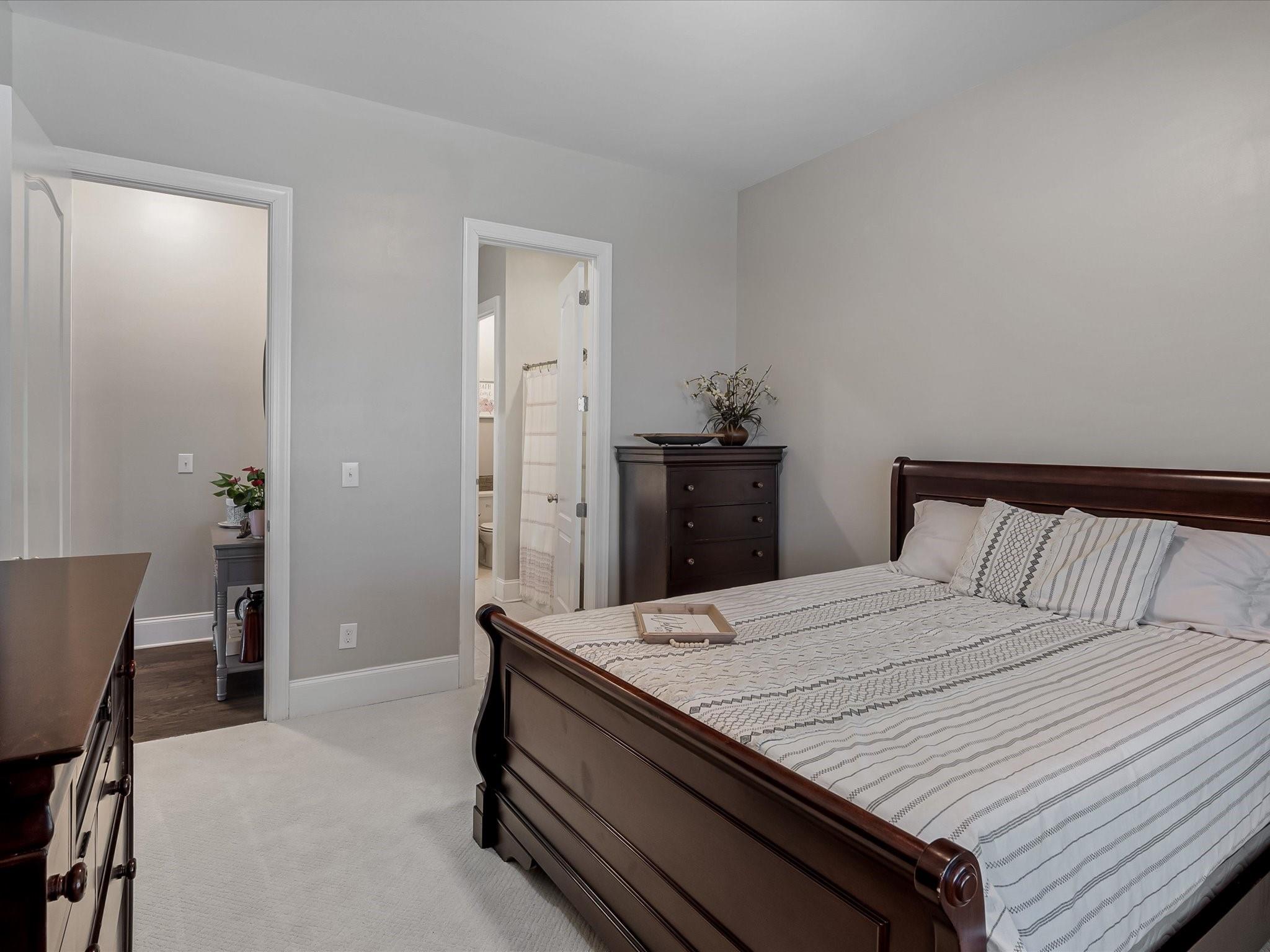 4876 Killian Crossing Drive Denver, NC 28037 - Photo 16 of 46 a bedroom with a bed and a table in it