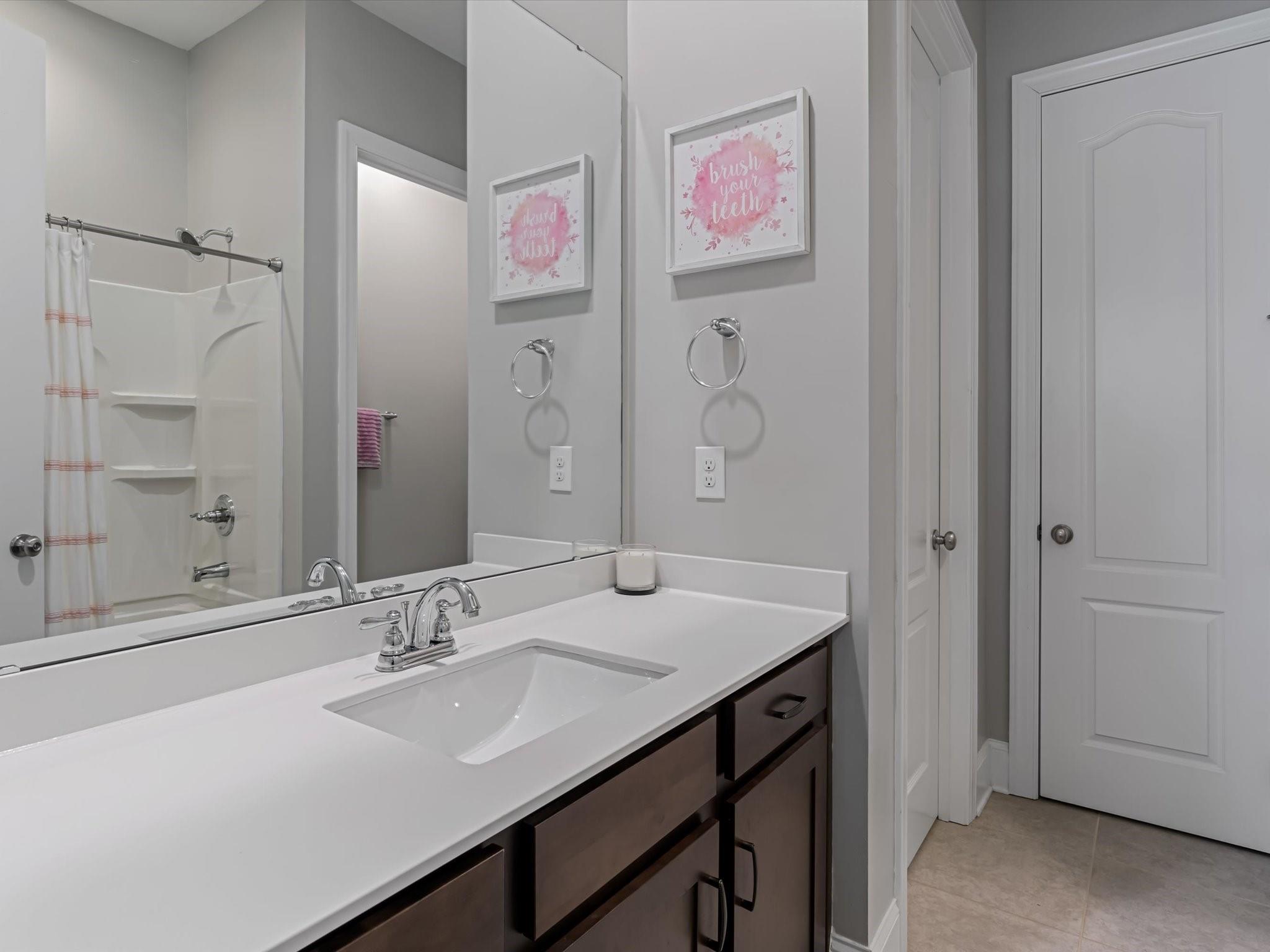 4876 Killian Crossing Drive Denver, NC 28037 - Photo 17 of 46 a bathroom with a sink vanity and a mirror