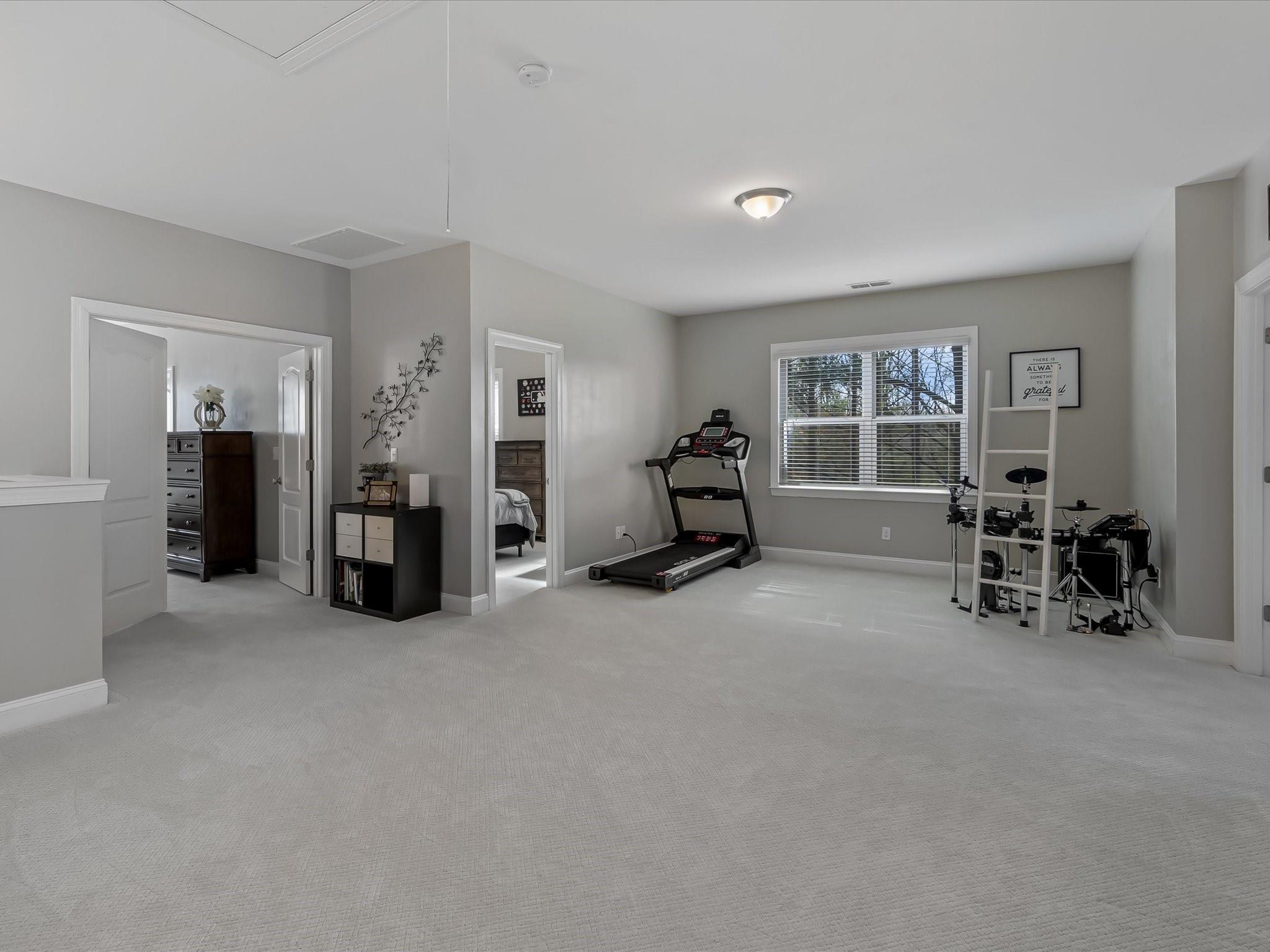 4876 Killian Crossing Drive Denver, NC 28037 - Photo 19 of 46 an empty room with furniture and a chair