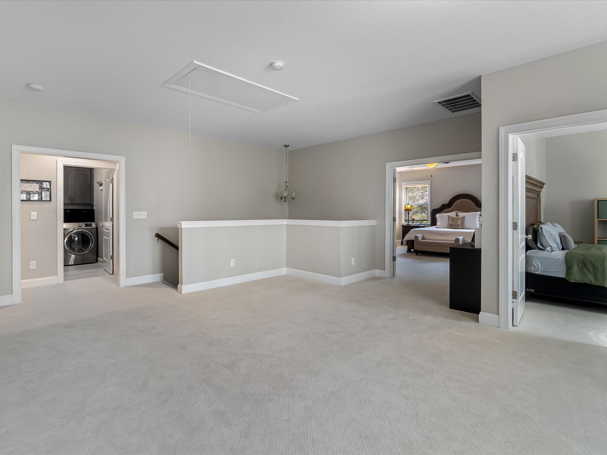 4876 Killian Crossing Drive Denver, NC 28037 - Photo 20 of 46 a living room with furniture and a lamp