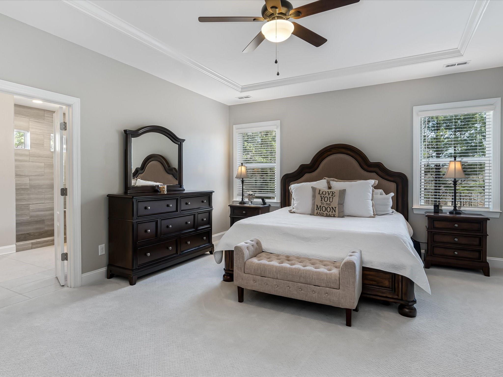 4876 Killian Crossing Drive Denver, NC 28037 - Photo 21 of 46 a bedroom with a bed and a chandelier