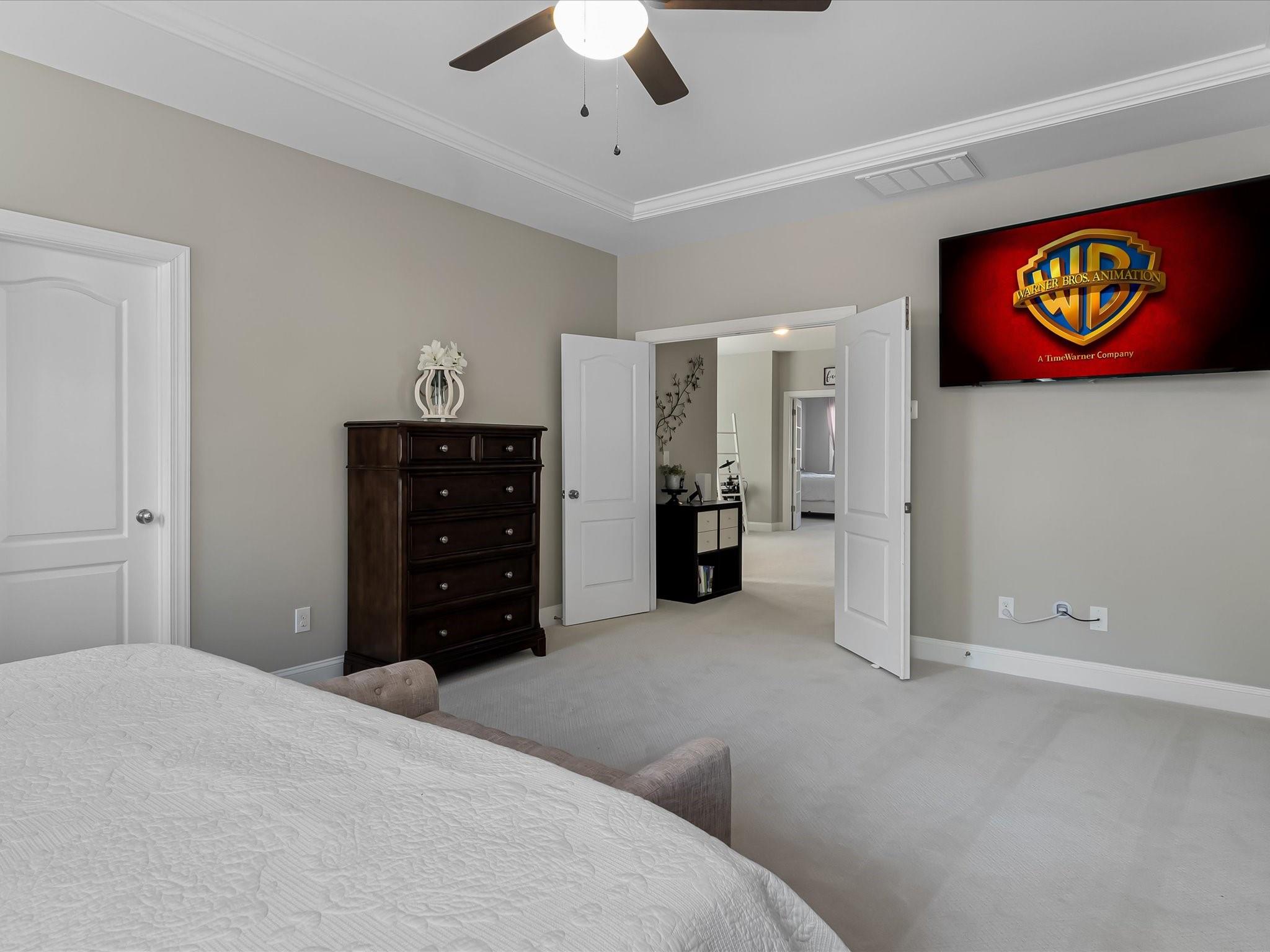 4876 Killian Crossing Drive Denver, NC 28037 - Photo 22 of 46 a bedroom with a bed and a chandelier