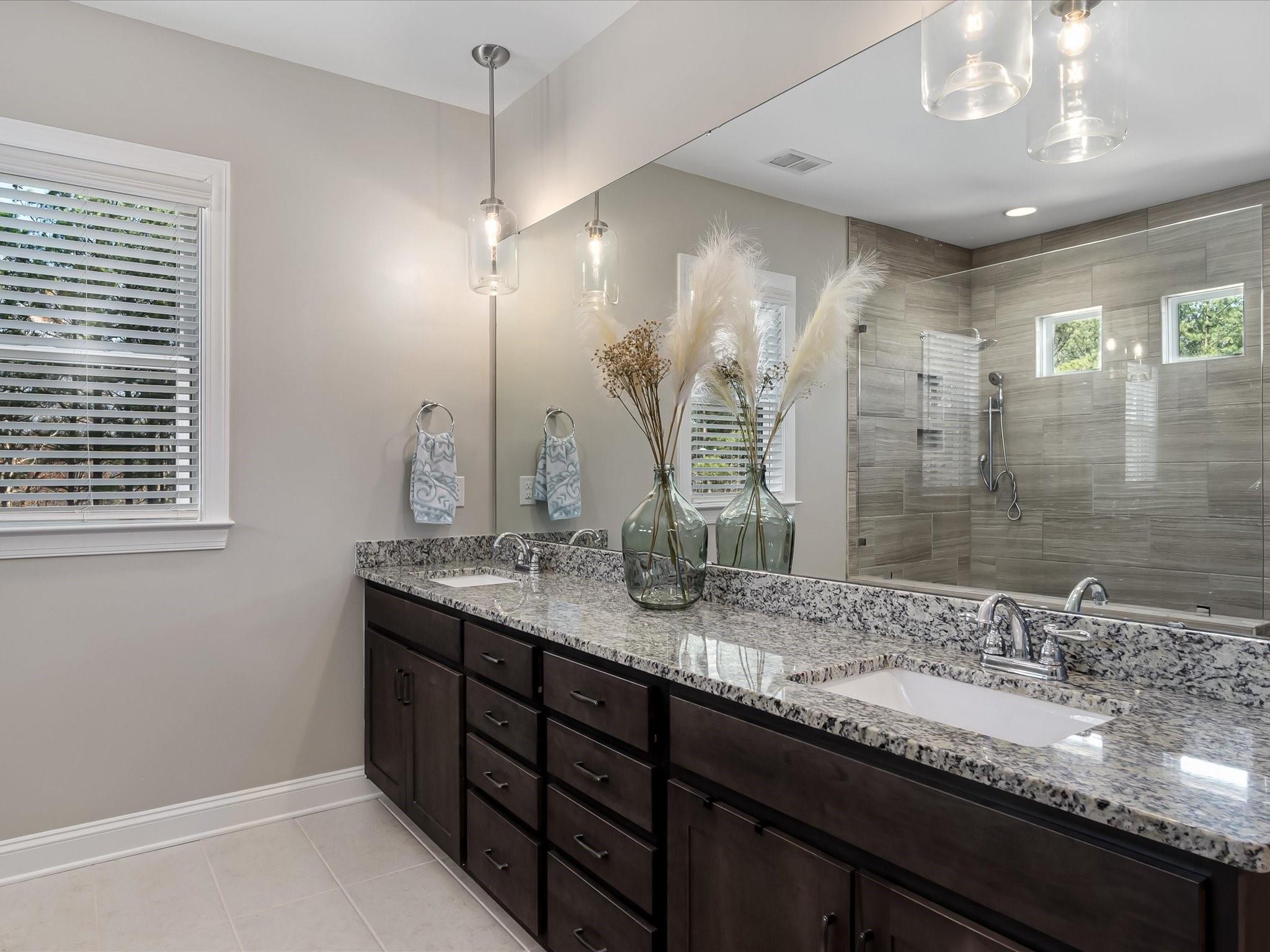 4876 Killian Crossing Drive Denver, NC 28037 - Photo 25 of 46 a bathroom with double sink and a mirror