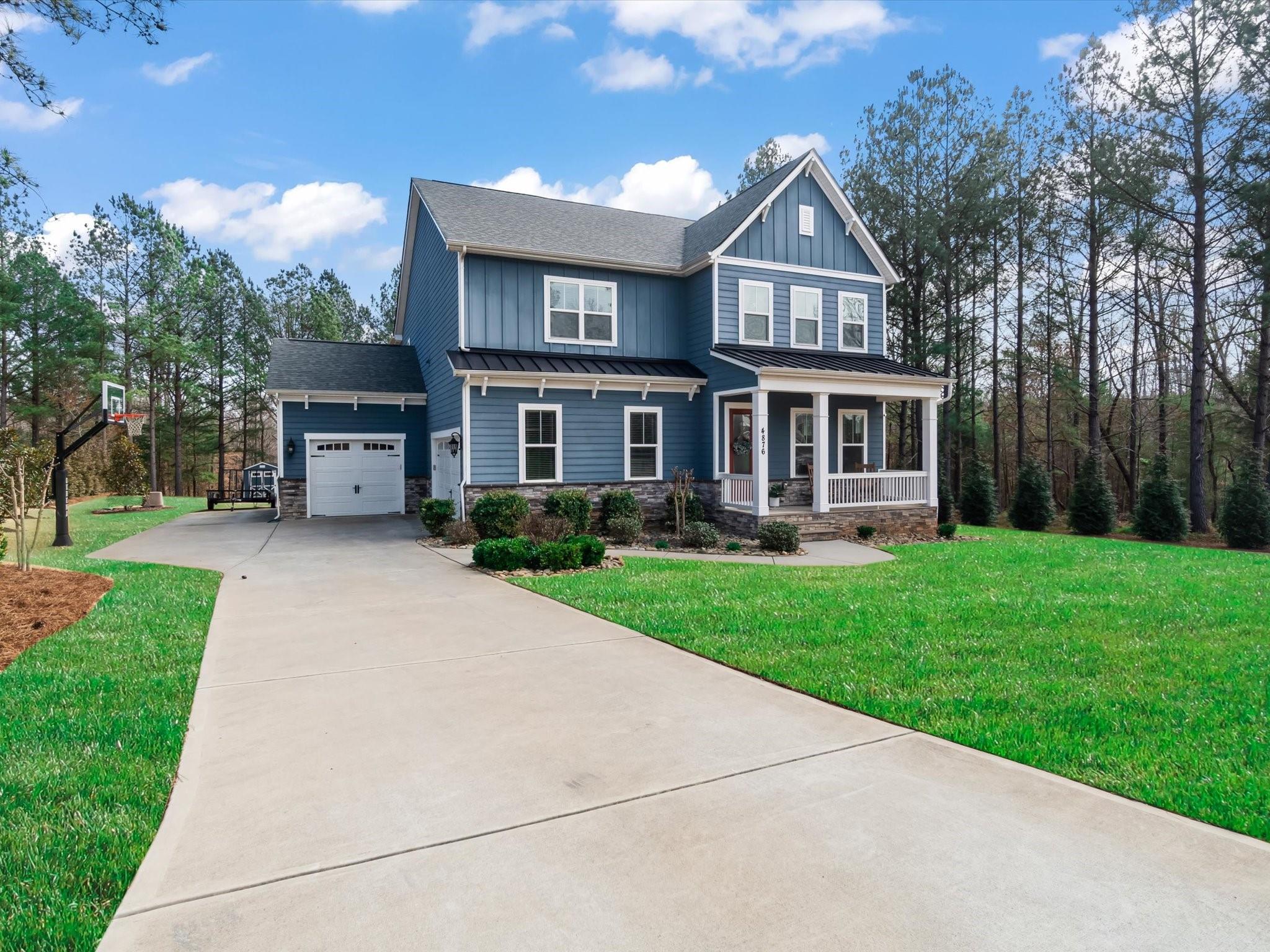 4876 Killian Crossing Drive Denver, NC 28037 - Photo 3 of 46 a front view of house with yard and green space