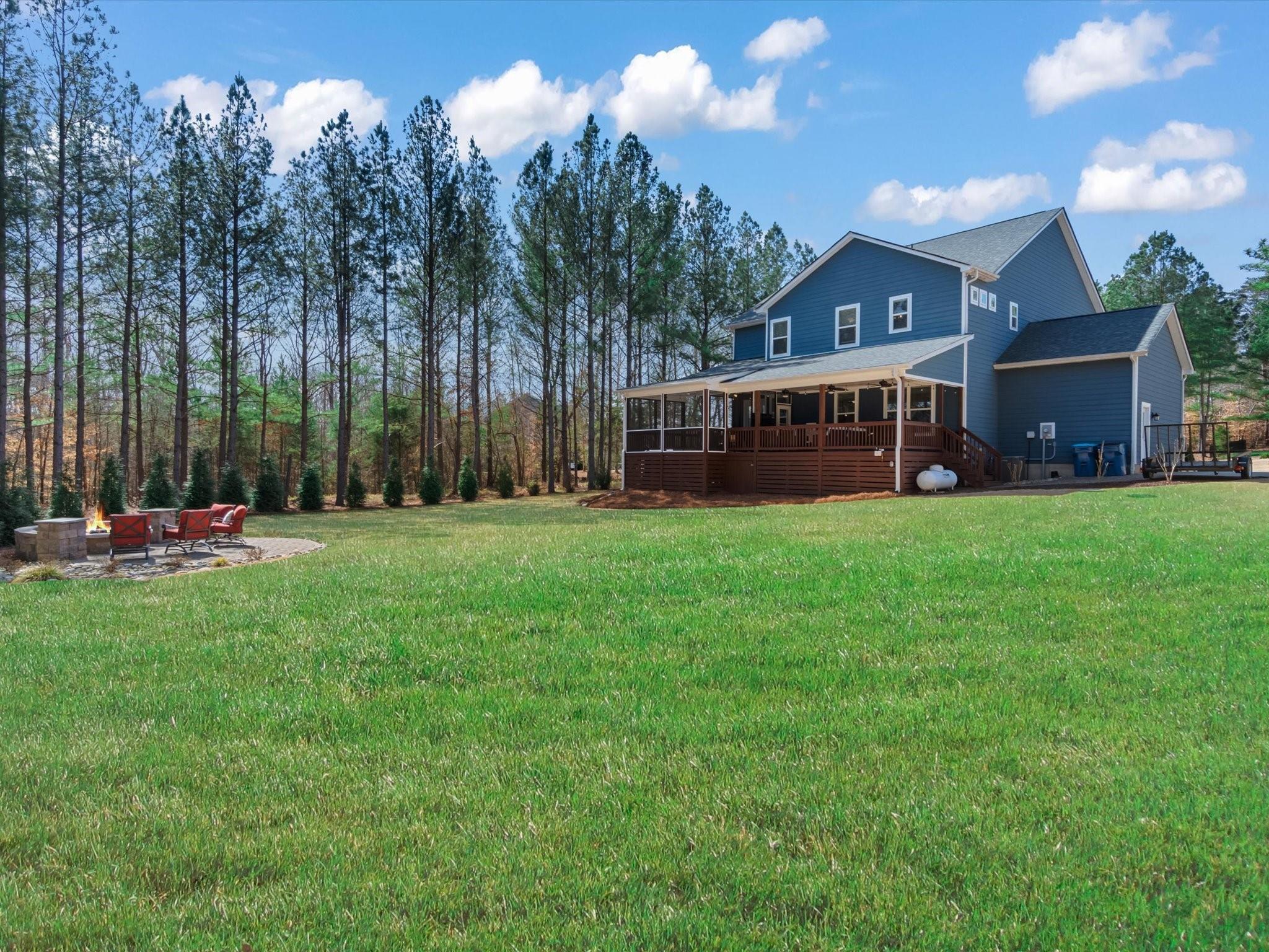 4876 Killian Crossing Drive Denver, NC 28037 - Photo 37 of 46 a view of a house with a big yard and large trees