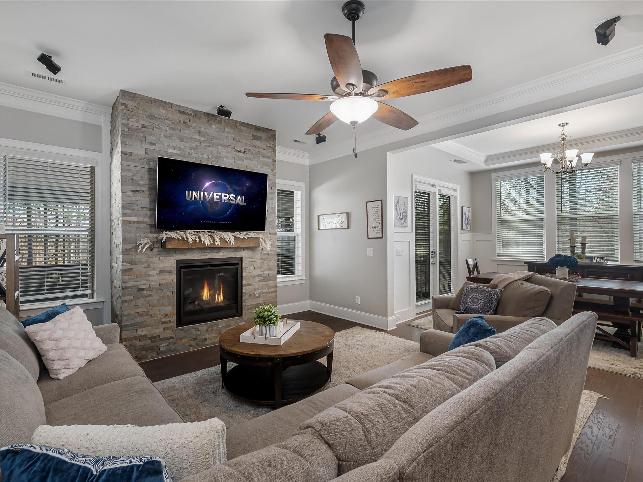4876 Killian Crossing Drive Denver, NC 28037 - Photo 6 of 46 a living room with furniture a fireplace and a flat screen tv