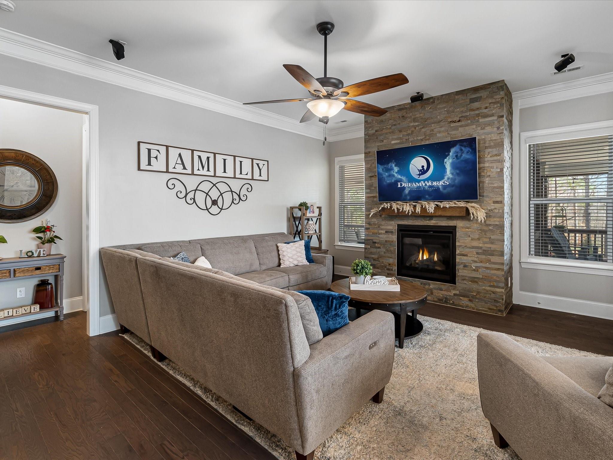 4876 Killian Crossing Drive Denver, NC 28037 - Photo 7 of 46 a living room with furniture and a fireplace