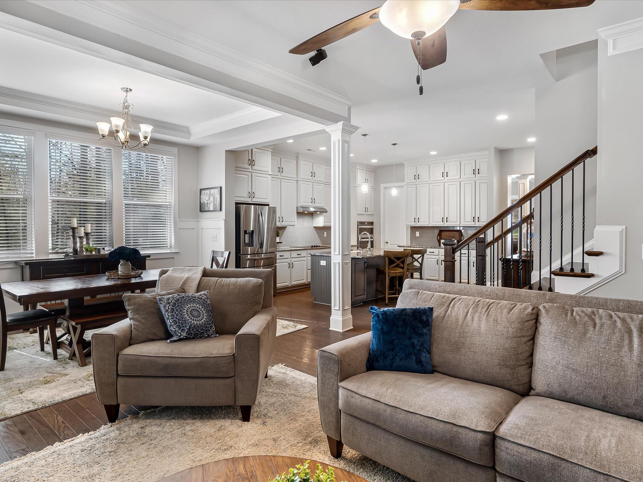4876 Killian Crossing Drive Denver, NC 28037 - Photo 8 of 46 a living room with furniture ceiling fan and a large window