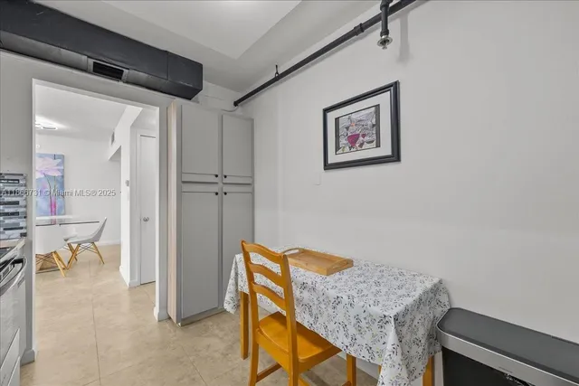 a view of a hallway with seating area