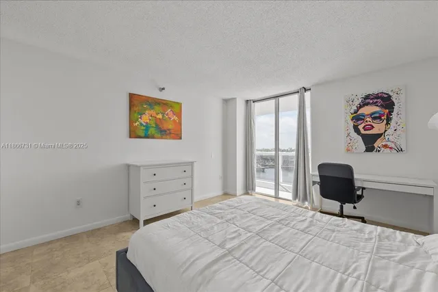 a bedroom with a bed and a chair