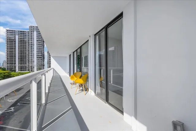a view of swimming pool with sitting area