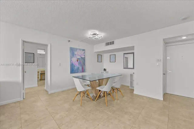 a view of a livingroom with furniture and front door