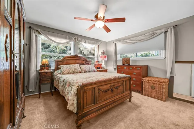 a bed room with a bed and a large window