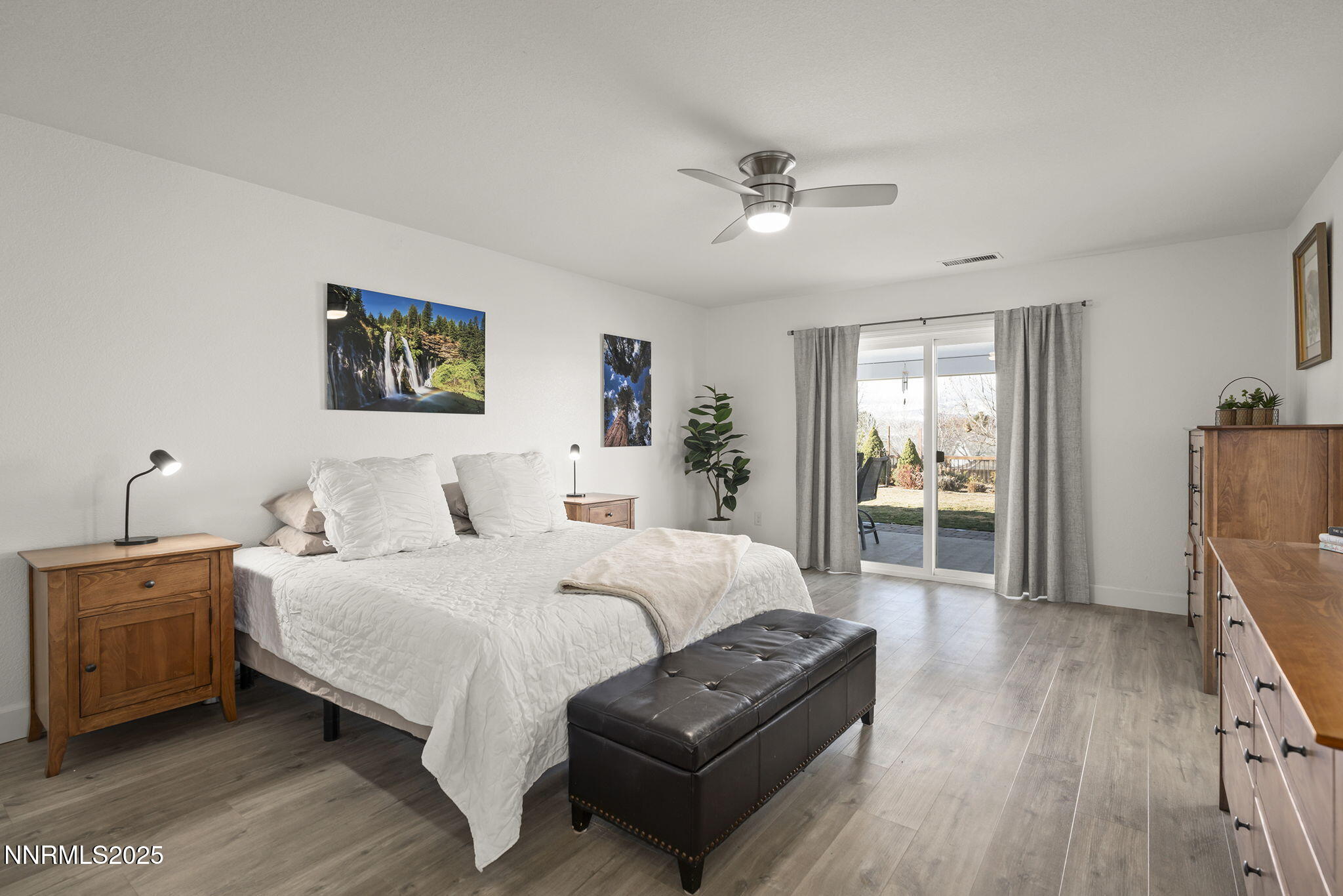 7707 Rhythm Circle Sparks, NV 89436 - Photo 11 of 30 a bedroom with bed and wooden floor