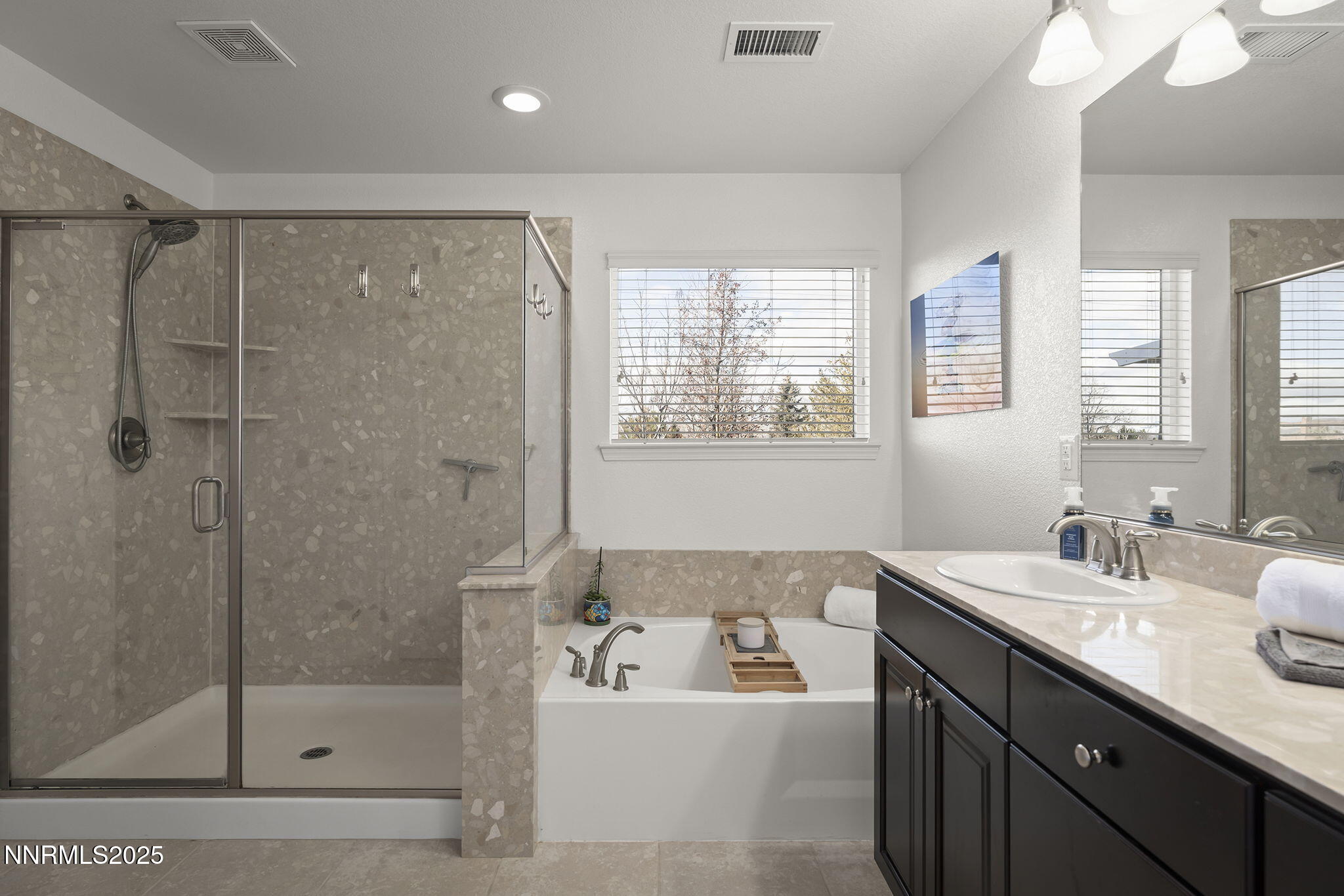 7707 Rhythm Circle Sparks, NV 89436 - Photo 13 of 30 a bathroom with a tub sink shower and mirror