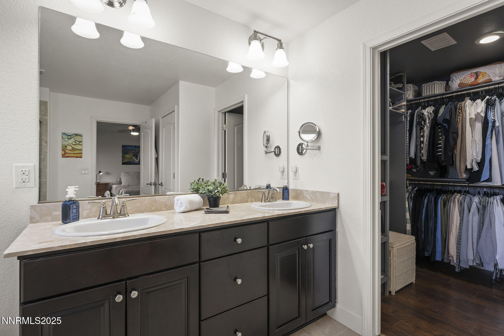 7707 Rhythm Circle Sparks, NV 89436 - Photo 14 of 30 a bathroom with a double vanity sink and a mirror
