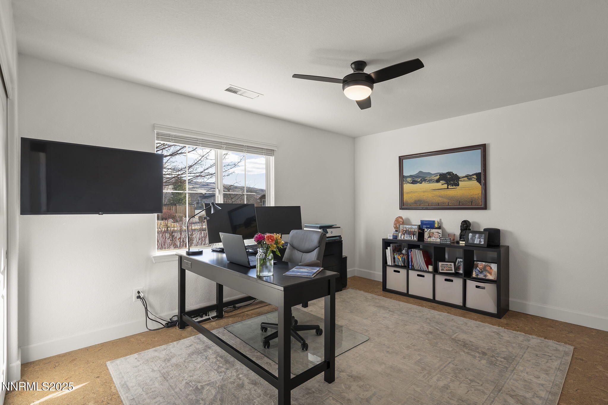 7707 Rhythm Circle Sparks, NV 89436 - Photo 17 of 30 a living room with furniture a flat screen tv and a window