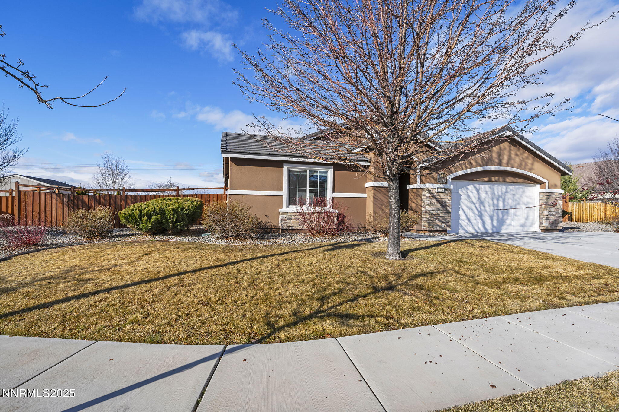 7707 Rhythm Circle Sparks, NV 89436 - Photo 3 of 30 a front view of a house with a yard