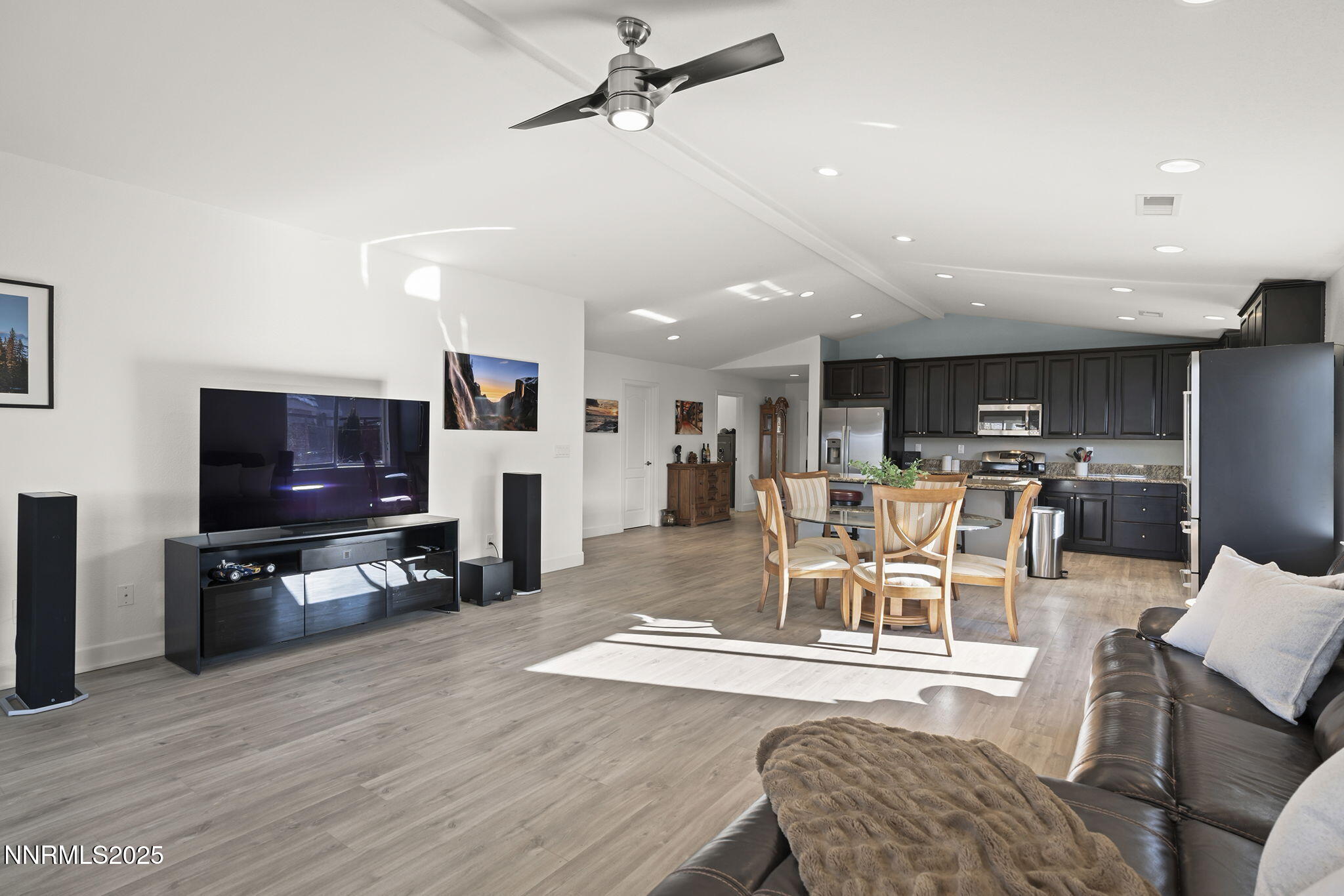 7707 Rhythm Circle Sparks, NV 89436 - Photo 5 of 30 a living room with furniture and a flat screen tv