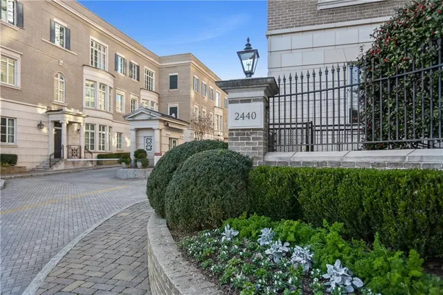 a view of a garden with a apartment