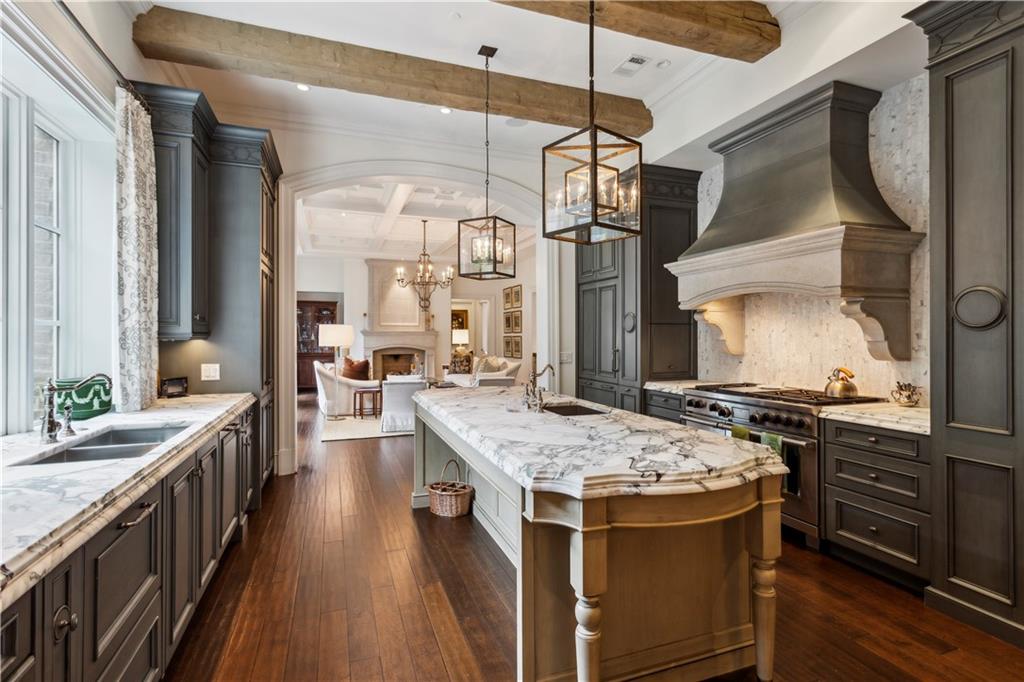 2440 Peachtree Road Northwest, Unit 6 Atlanta, GA 30305 - Photo 11 of 34 a kitchen with stainless steel appliances granite countertop a stove a sink dishwasher and a refrigerator with wooden floor