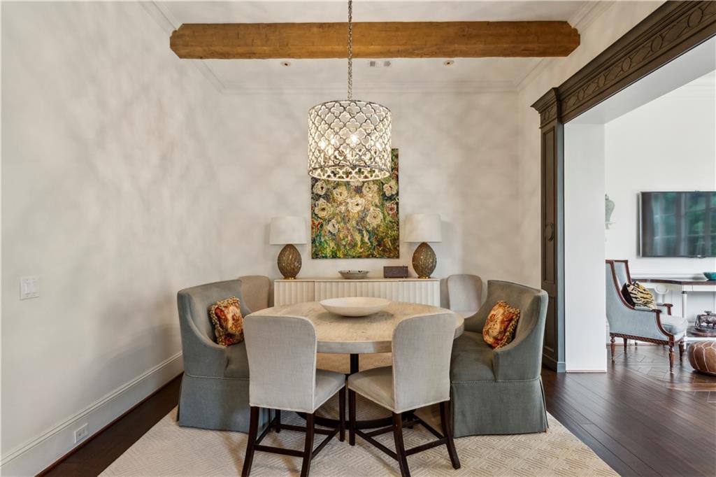 2440 Peachtree Road Northwest, Unit 6 Atlanta, GA 30305 - Photo 14 of 34 a view of a dining room with furniture and wooden floor