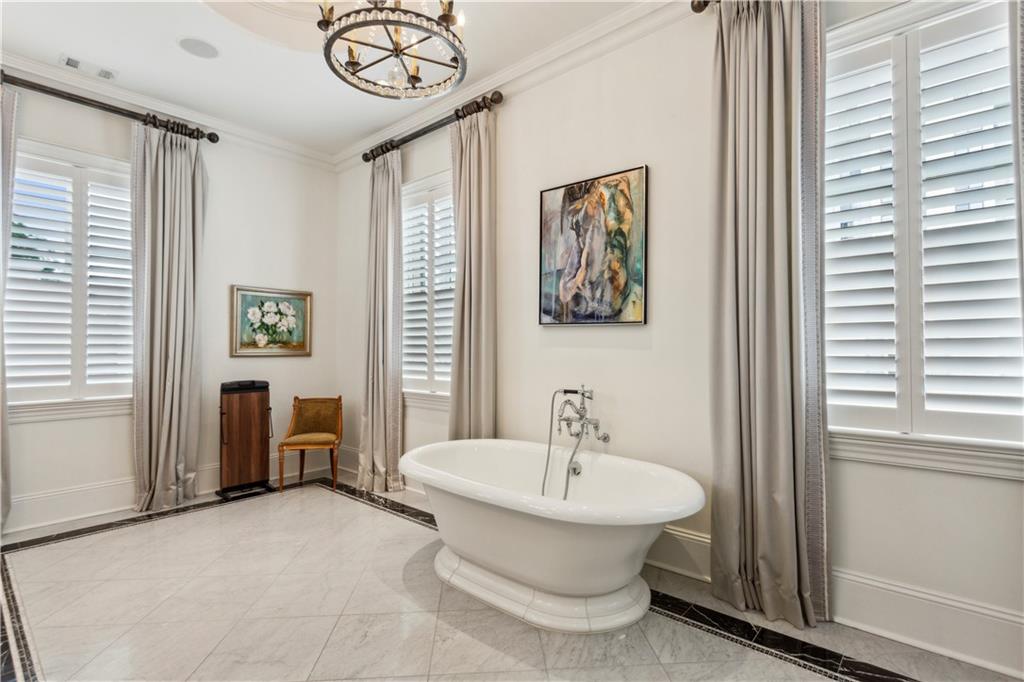 2440 Peachtree Road Northwest, Unit 6 Atlanta, GA 30305 - Photo 17 of 34 a bathroom with a toilet a sink and mirror