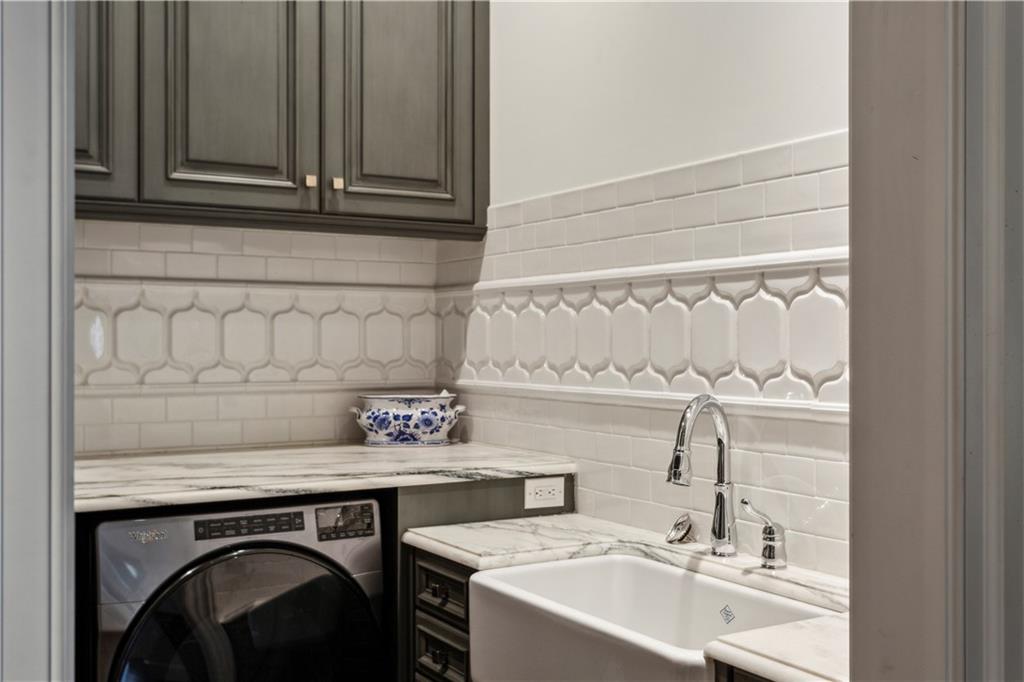 2440 Peachtree Road Northwest, Unit 6 Atlanta, GA 30305 - Photo 18 of 34 a bathroom with a sink and a mirror