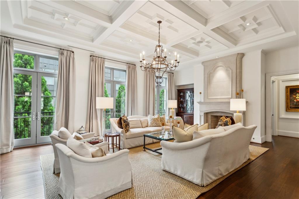 2440 Peachtree Road Northwest, Unit 6 Atlanta, GA 30305 - Photo 2 of 34 a living room with furniture a chandelier and a large window