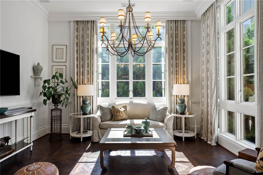 2440 Peachtree Road Northwest, Unit 6 Atlanta, GA 30305 - Photo 21 of 34 a living room with furniture a flat screen tv and a large window
