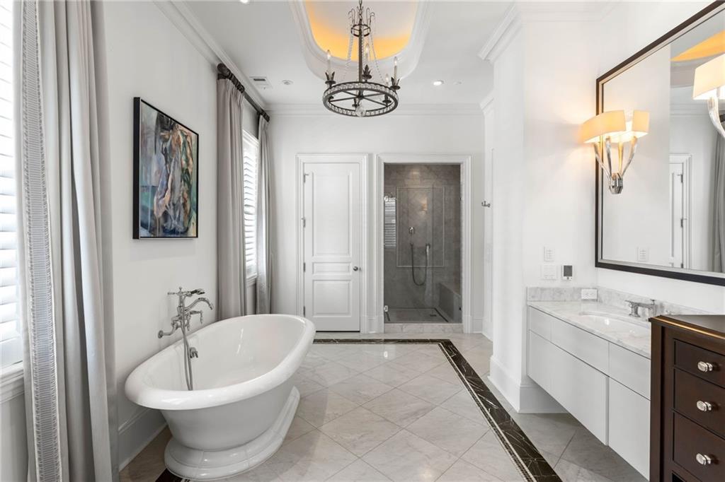 2440 Peachtree Road Northwest, Unit 6 Atlanta, GA 30305 - Photo 29 of 34 a bathroom with a sink a toilet and shower