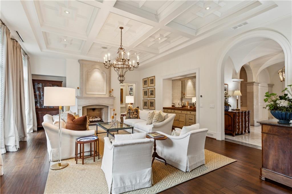 2440 Peachtree Road Northwest, Unit 6 Atlanta, GA 30305 - Photo 3 of 34 a living room with fireplace furniture and a chandelier