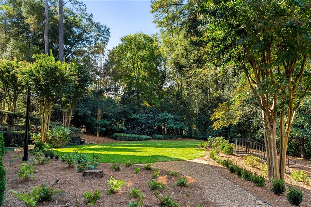 2440 Peachtree Road Northwest, Unit 6 Atlanta, GA 30305 - Photo 32 of 34 a view of a swimming pool with a yard