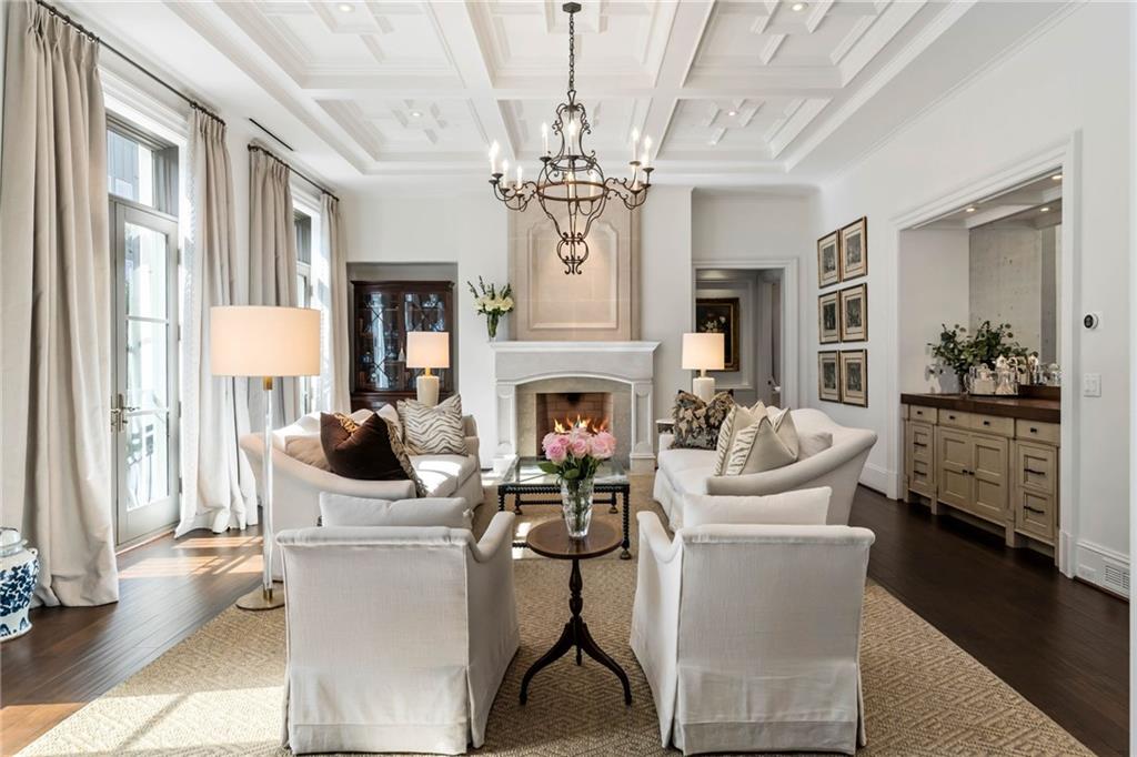 2440 Peachtree Road Northwest, Unit 6 Atlanta, GA 30305 - Photo 5 of 34 a living room with furniture a chandelier and a fireplace