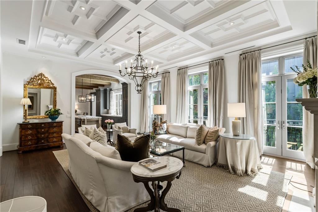 2440 Peachtree Road Northwest, Unit 6 Atlanta, GA 30305 - Photo 7 of 34 a living room with furniture and a chandelier
