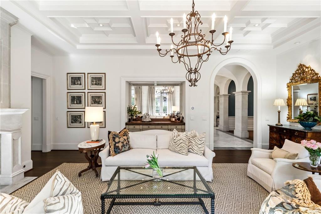 2440 Peachtree Road Northwest, Unit 6 Atlanta, GA 30305 - Photo 8 of 34 a living room with furniture and a chandelier