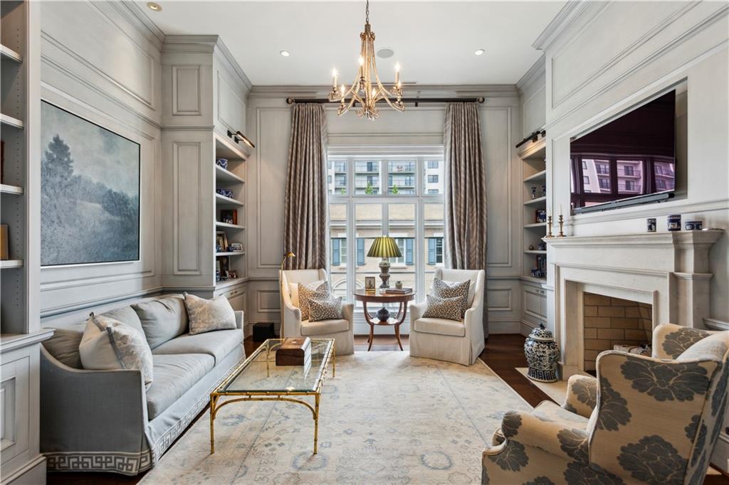 2440 Peachtree Road Northwest, Unit 6 Atlanta, GA 30305 - Photo 9 of 34 a living room with furniture a large window and a fireplace