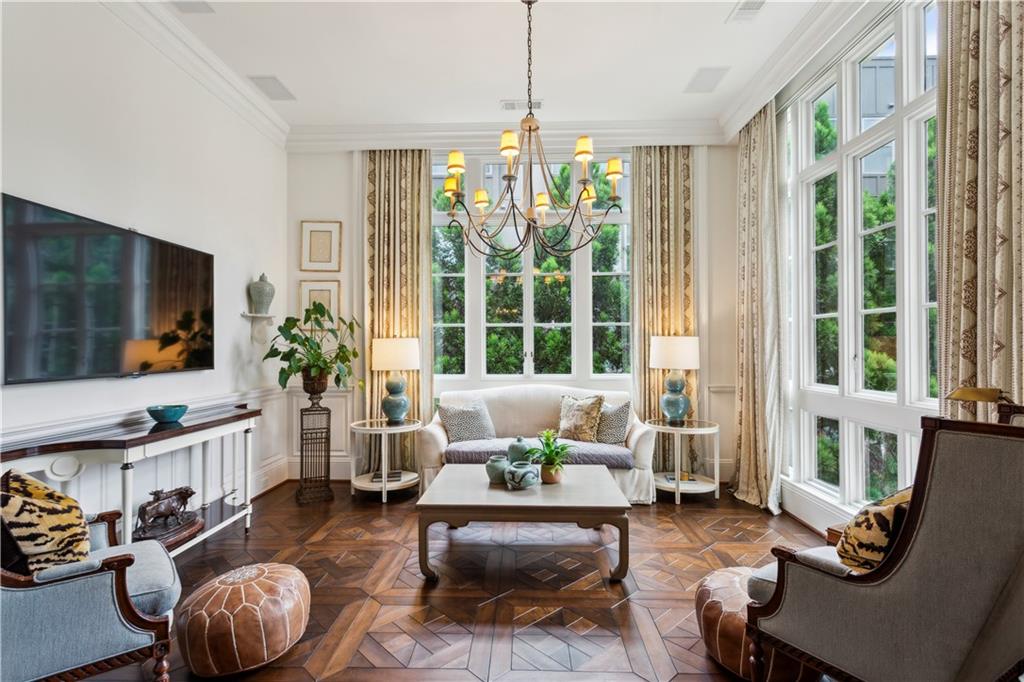 2440 Peachtree Road Northwest, Unit 6 Atlanta, GA 30305 - Photo 10 of 34 a living room with furniture and a flat screen tv