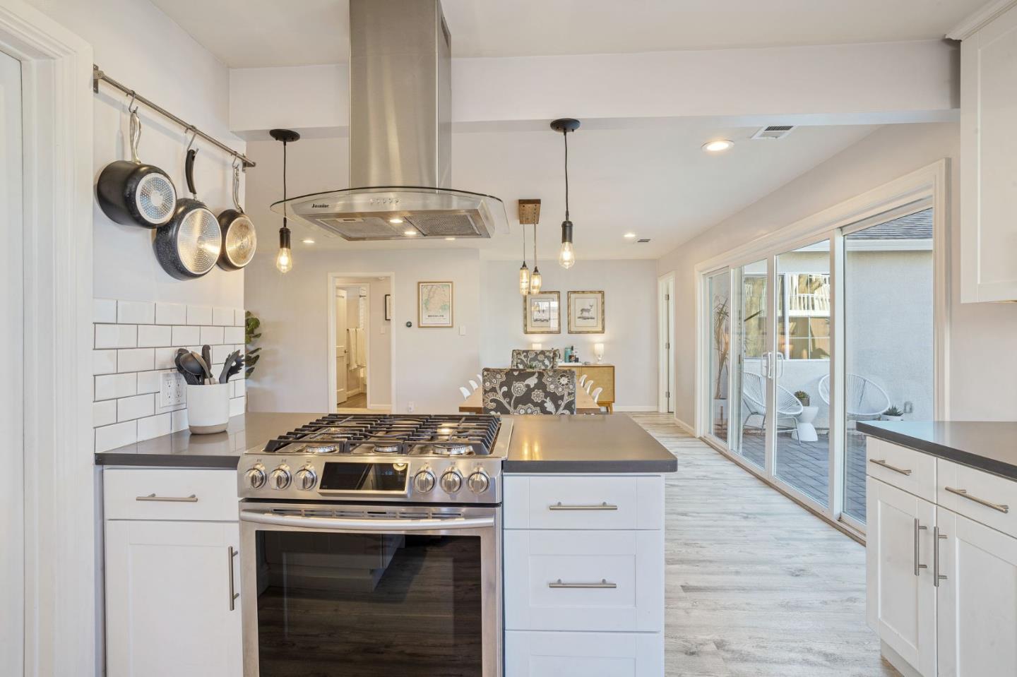 1851 Nash Drive San Mateo, CA 94401 - Photo 12 of 46 a kitchen with granite countertop a stove and a wooden floors