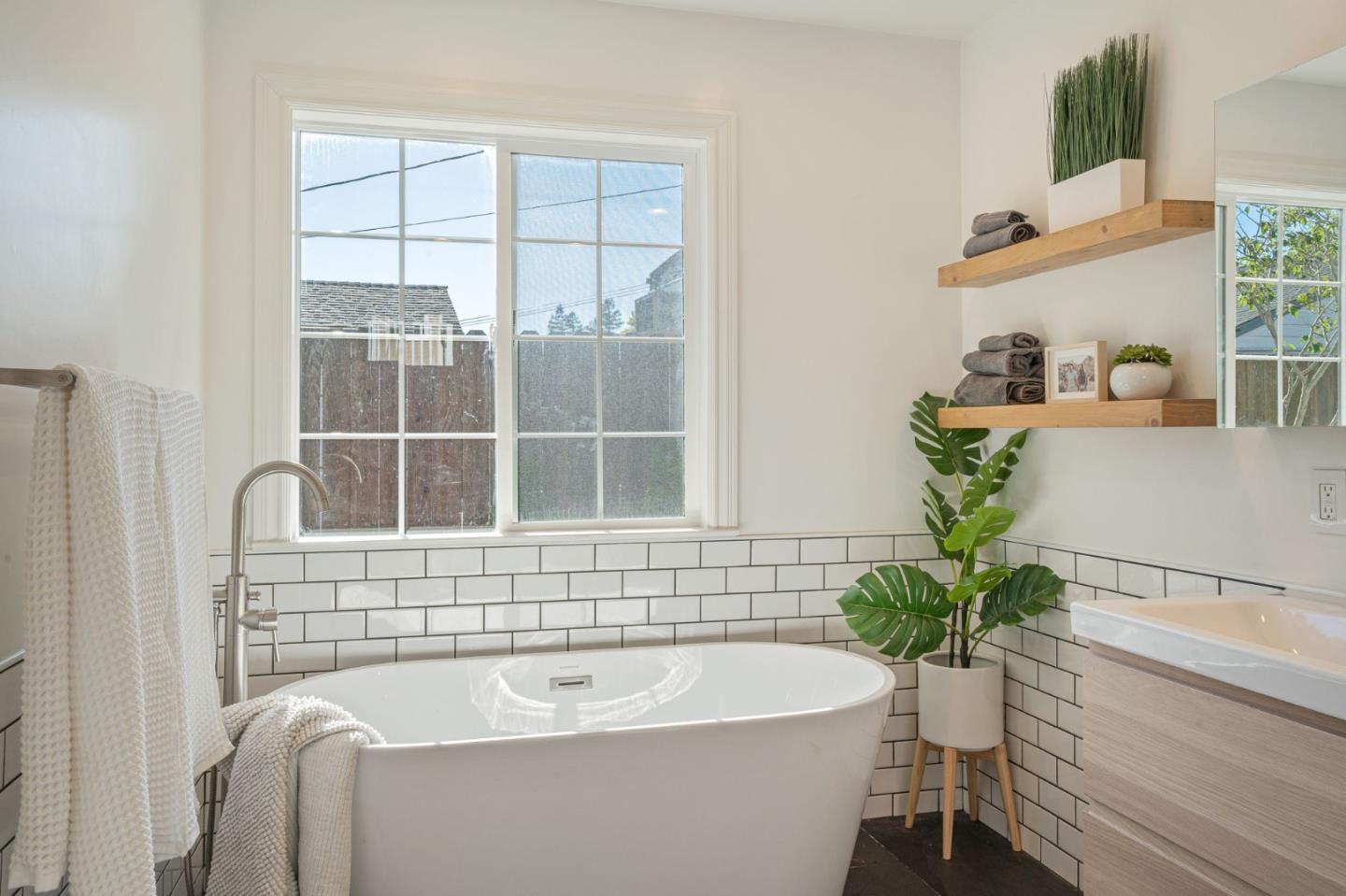 1851 Nash Drive San Mateo, CA 94401 - Photo 18 of 46 a bath tub sitting in a bathroom next to a window