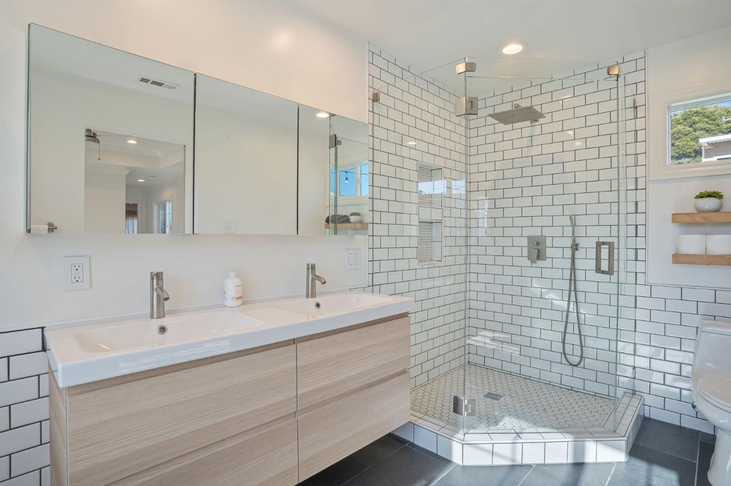 1851 Nash Drive San Mateo, CA 94401 - Photo 21 of 46 a bathroom with a shower sink and mirror