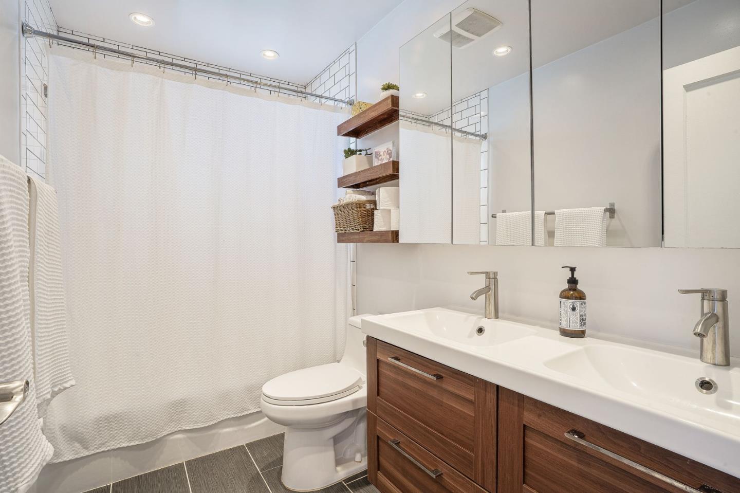 1851 Nash Drive San Mateo, CA 94401 - Photo 25 of 46 a bathroom with a sink a toilet and shower