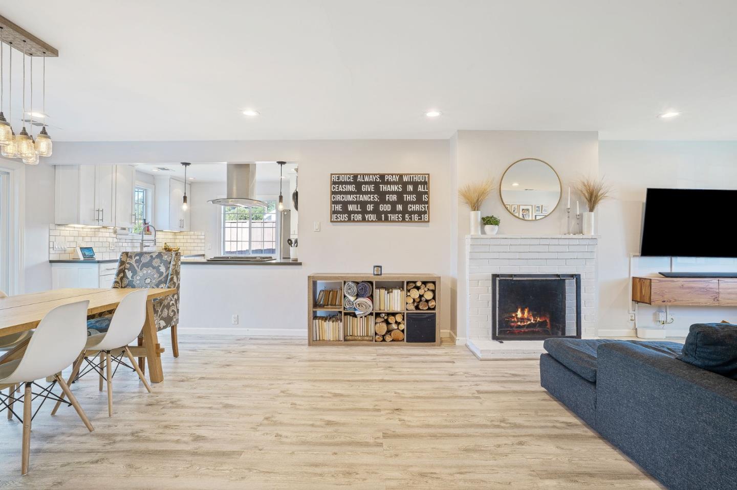 1851 Nash Drive San Mateo, CA 94401 - Photo 5 of 46 a living room with furniture a fireplace and a flat screen tv