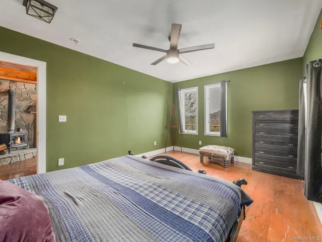 a bed sitting in a bedroom next to a window