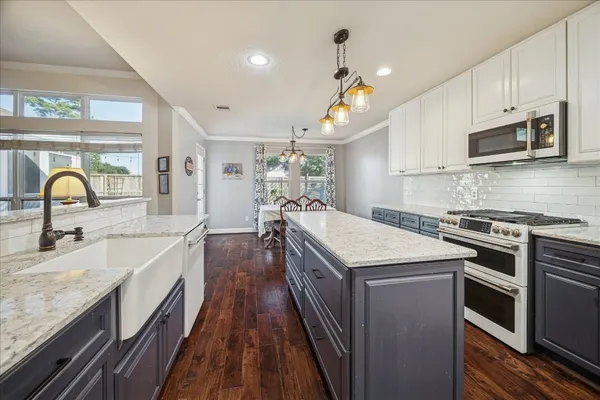 a kitchen with a stove and a sink