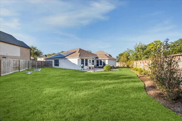 a view of a house with a big yard