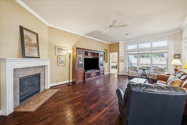 a living room with furniture and a fireplace