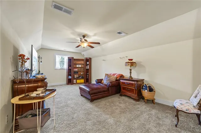 a bedroom with furniture and a chandelier